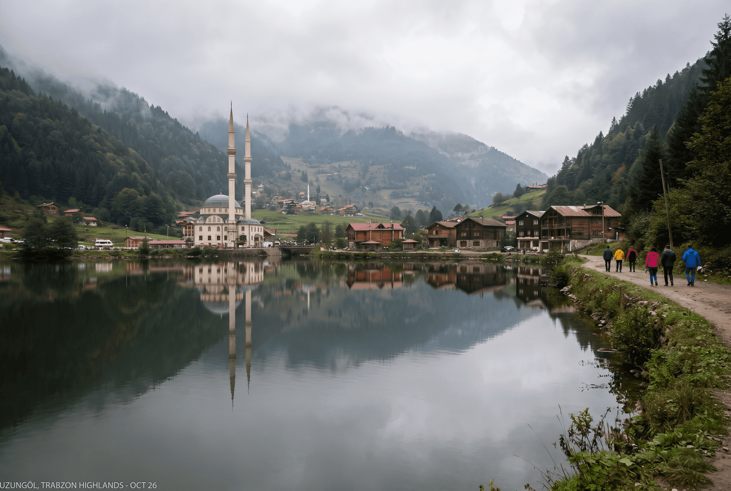 Uzungöl lake with mosque and wooden houses reflected